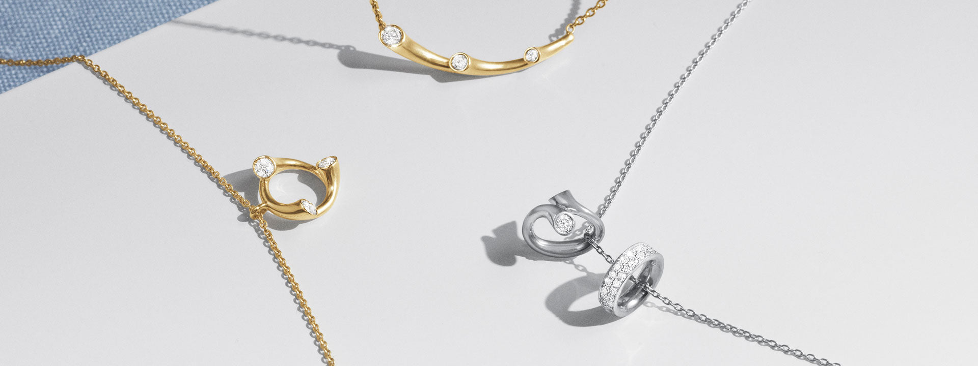 Georg Jensen Magic halskæder i guld og hvidguld med diamanter