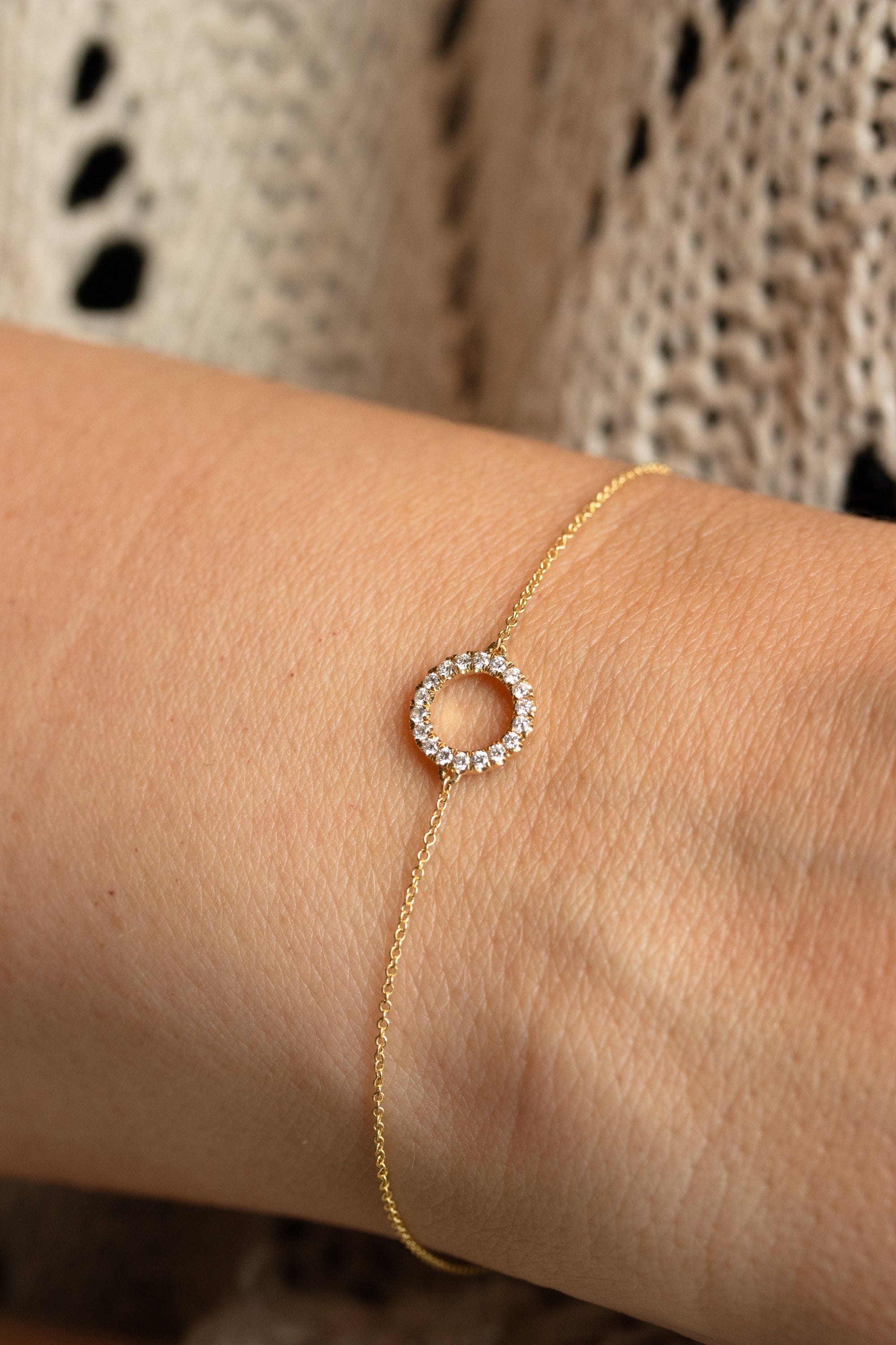 Halo armbånd i guld med 0,13 carat diamanter