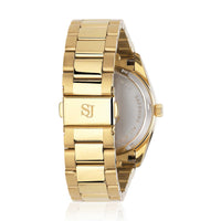 Sif Jakobs Aurora i guld tone med grøn skive og zirkonia sten rundt kransen, set bagfra