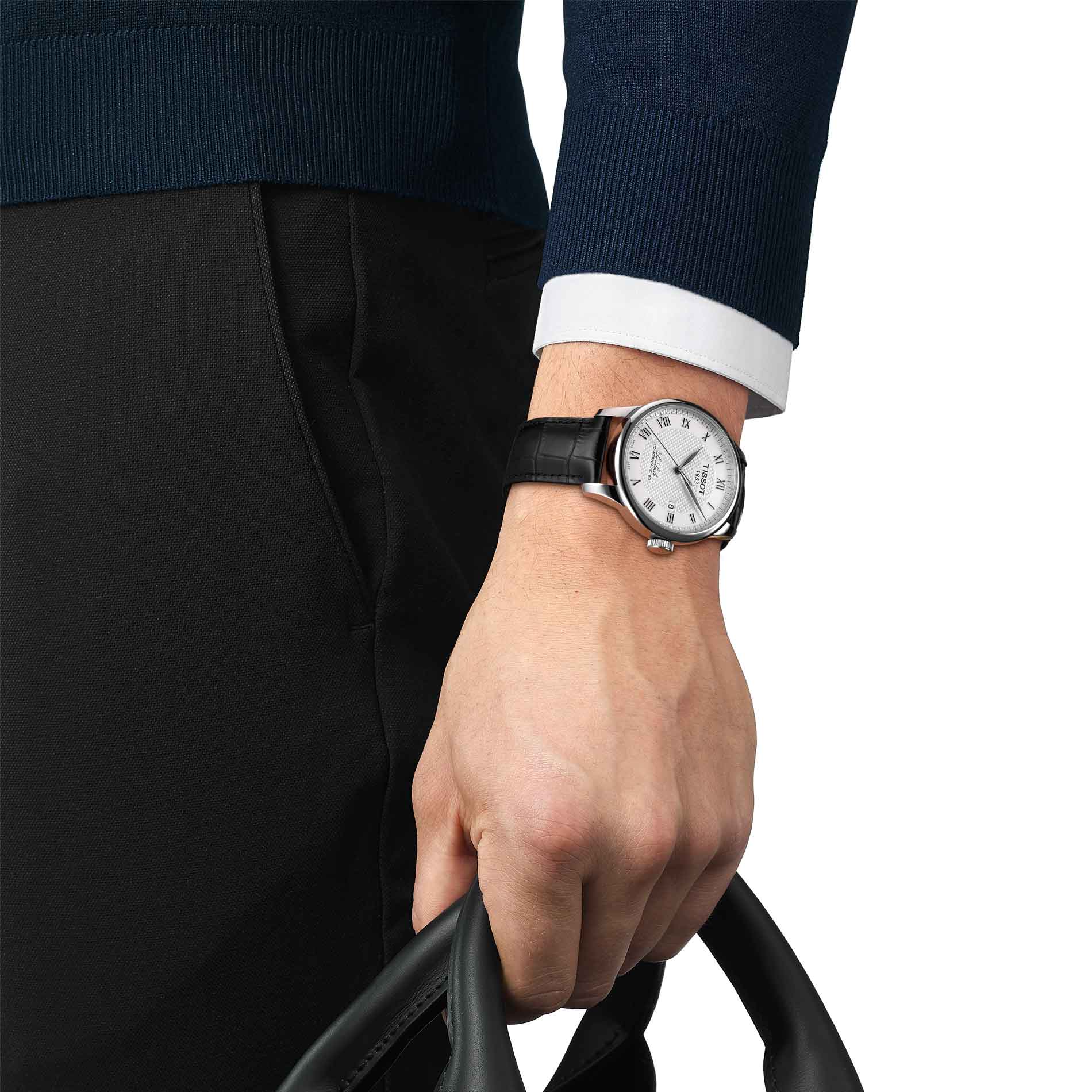 Klassisk herreur med sølv skive og sort læderrem fra Tissot, på håndled