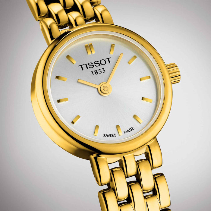 Guldfarvet dameur fra tissot med sølv skive