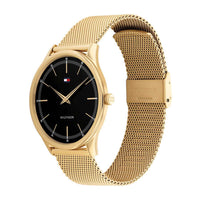 Guldtonet ur fra Tommy Hilfiger med sort skive, set fra siden