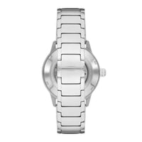 Emporio Armani Mario AR60053 automatisk herreur i stål med lænke og transparent bagkasse. Uret har en grøn skive med gulddetaljer. Uret er set bagfra.