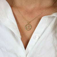 Guldvedhæng med to hjerter i en ring fra Aagaard