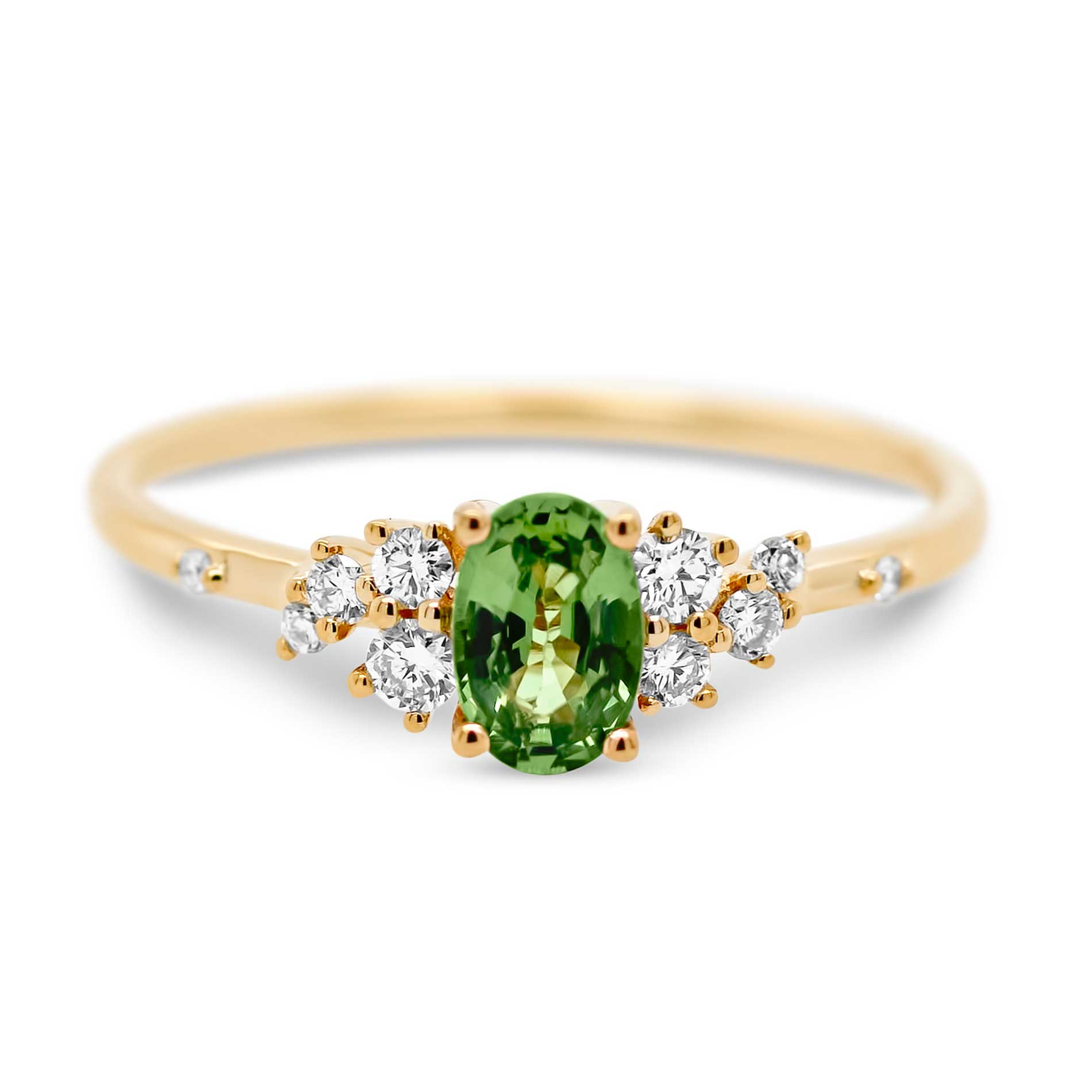 Guldring med diamanter og en grøn safir
