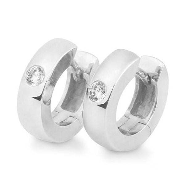 creoler i hvidguld med en enkelt diamant i hver ørering