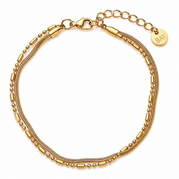 Bay by Aqua Dulce Flowy armbånd i forgyldt stål med bølgende detaljer