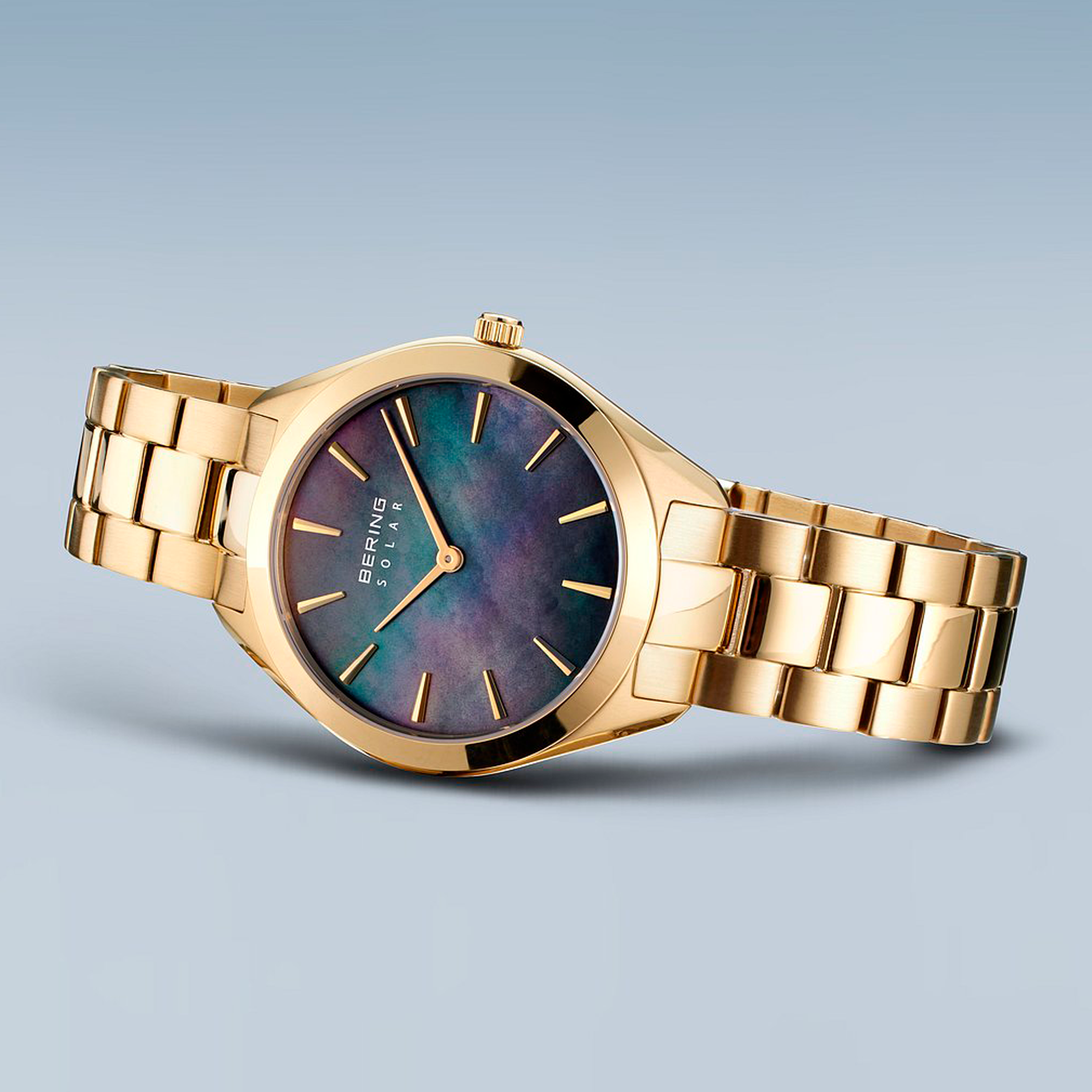 Bering Solar 31 mm model 17331-732 med blå perlemorsurskive og guldfarvet stållænke