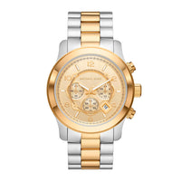 Michael Kors Runway MK9075 ur i rustfrit stål med gyldne detaljer på krans og lænke. Uret har en smuk gylden skive med tre chronographer samt dato. Uret er set forfra.