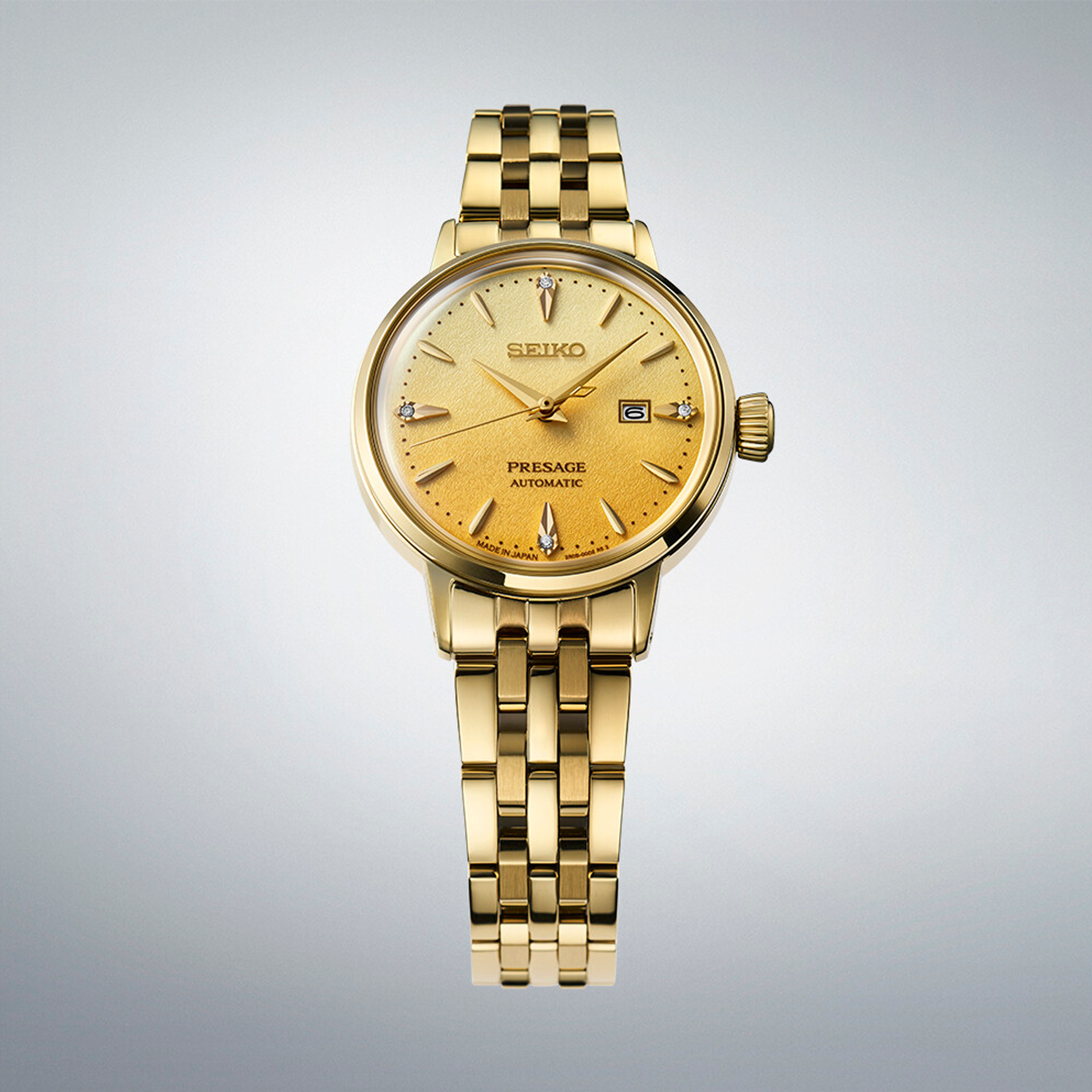 Seiko Presage Cocktail Time Automatic SRE018J1 dameur i guldfarvet stål med gylden urskive og datovisning
