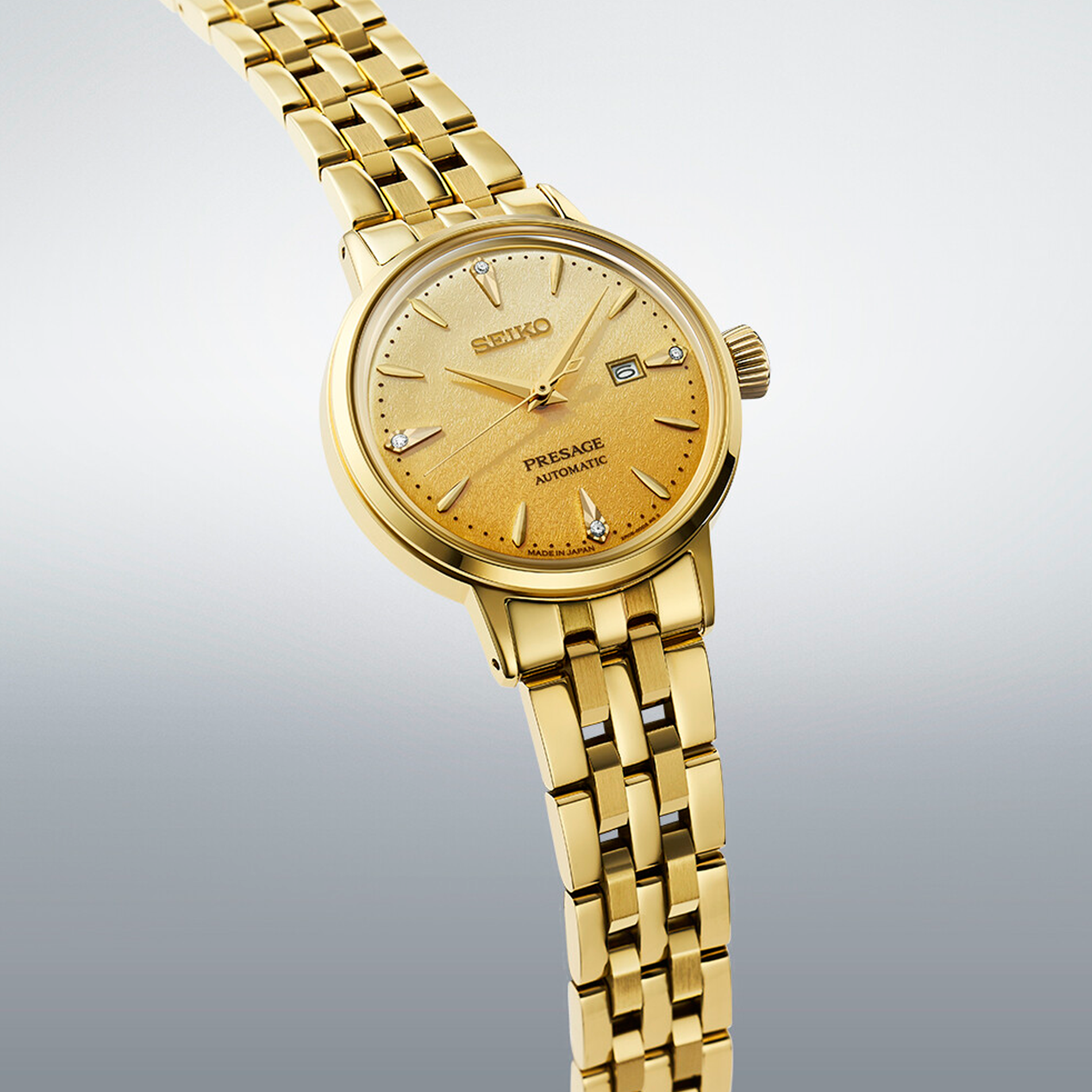 Seiko Presage Cocktail Time Automatic SRE018J1 dameur i guldfarvet stål med gylden urskive og datovisning