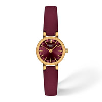Tissot Lovely Round 19,5 mm dameur med bordeaux urskive, guldfarvet urkasse og bordeaux læderrem.